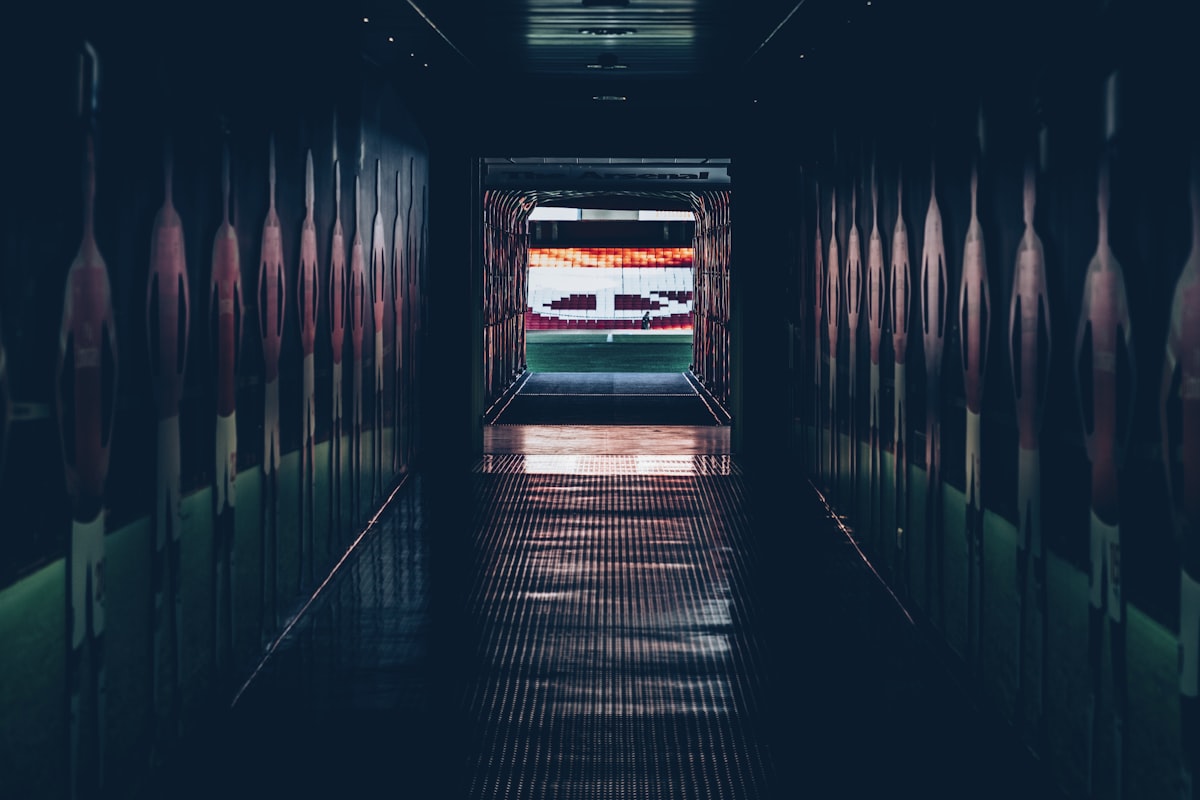 A stadium players' tunnel opening onto the pitch